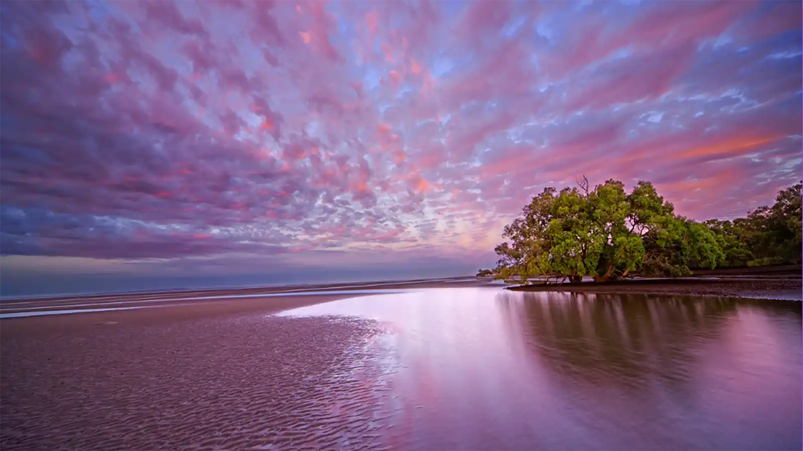 Vivid orange and pink Australian sunset over the outback horizon, evoking the wonder of True Blue Pen Pals screen-free adventures for children
