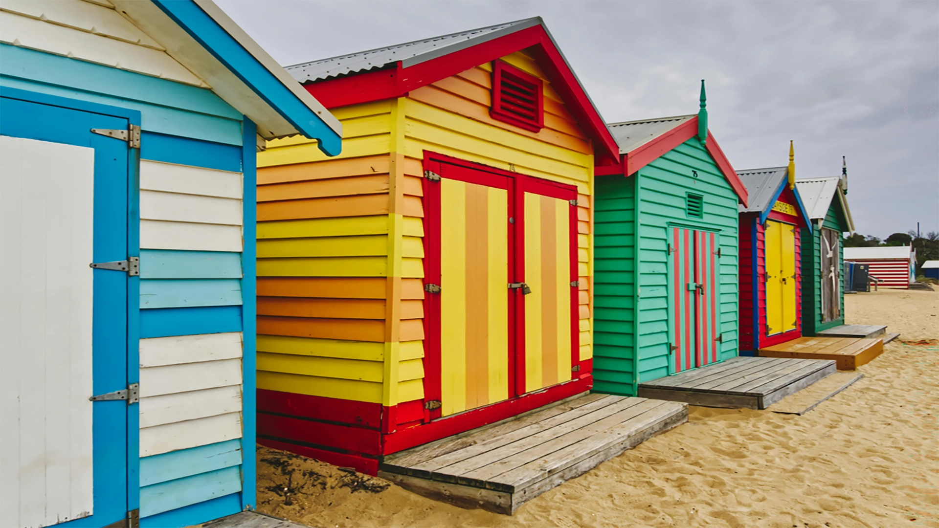 Colourful Brighton Beach bathing boxes along Melbourne's Port Phillip Bay, a iconic Australian landmark explored in True Blue Pen Pals adventure letters